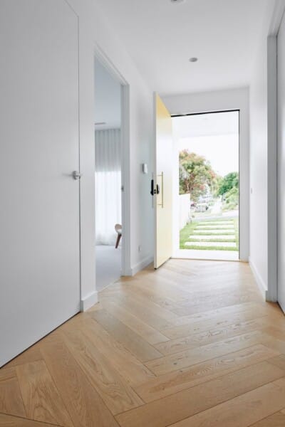 Light colored herringbone timber flooring in a home